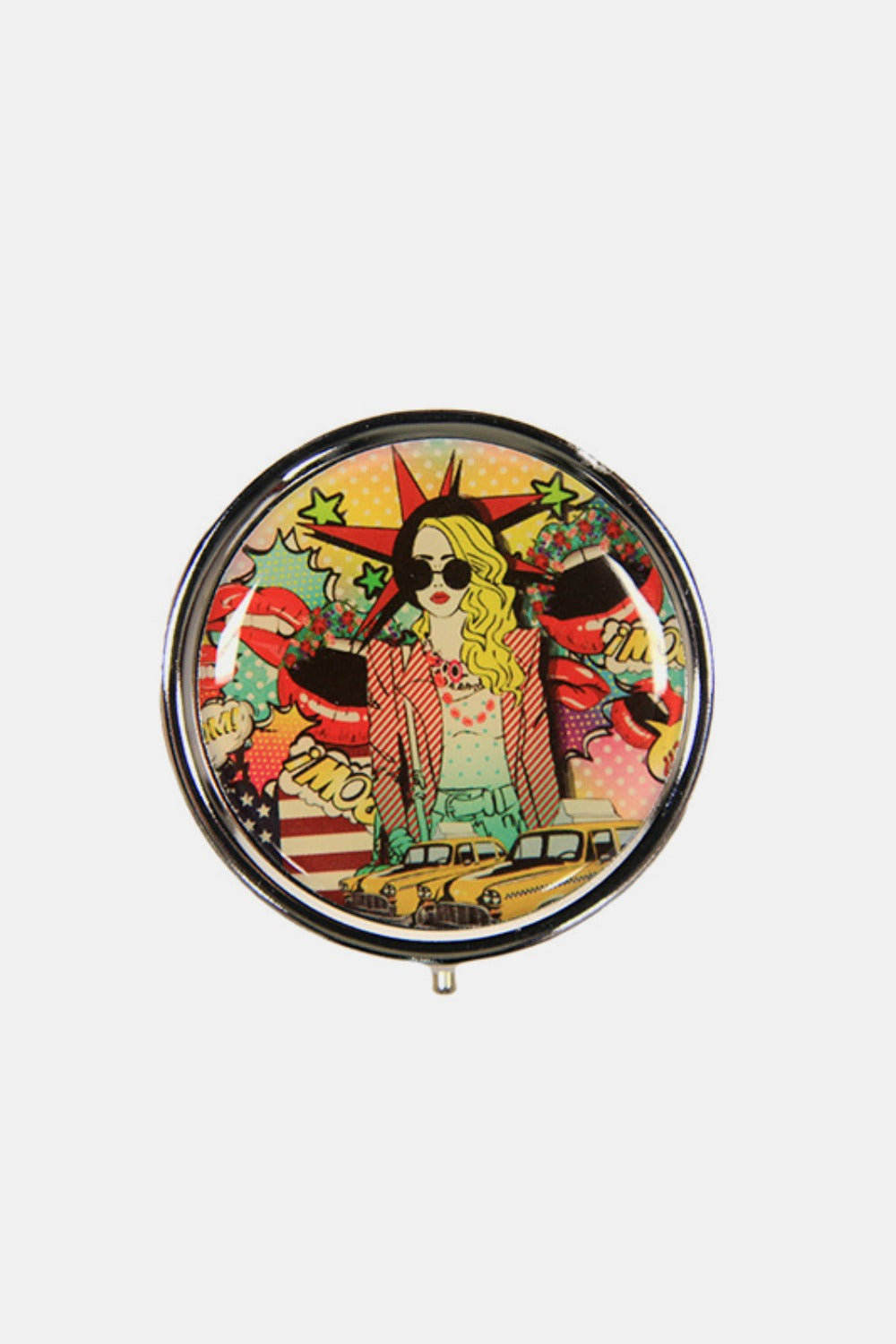 The Nicole Lee USA Print Metallic Circular Small Pill Case holds a metal pin that showcases an illustration of a dog and cat driving a red convertible through a city adorned with iconic buildings and landmarks, all wrapped in a sleek silver-tone metal exterior.