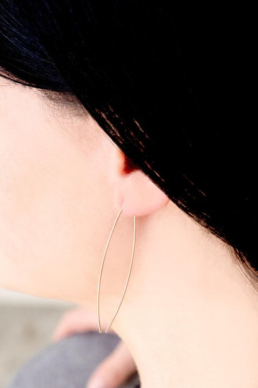 Pair of delicate Arc Threader Earrings on a white background.