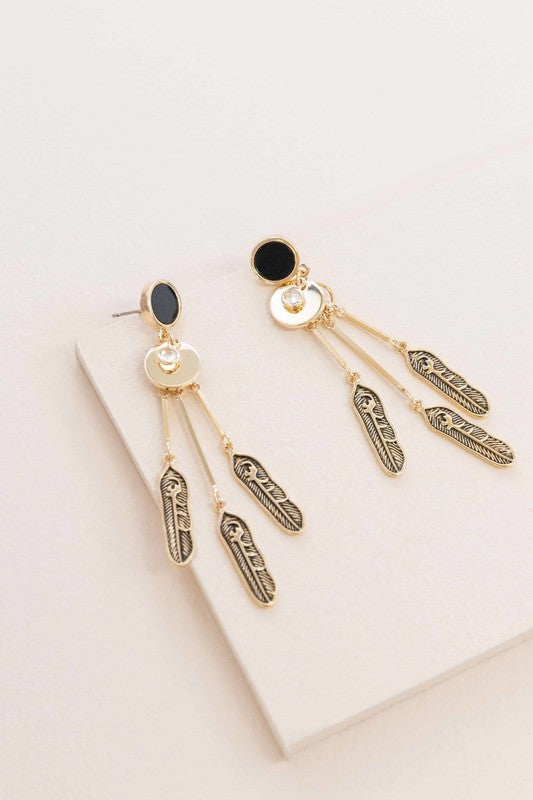 Good Spirits Dangle Earrings with blue accents on a light background.