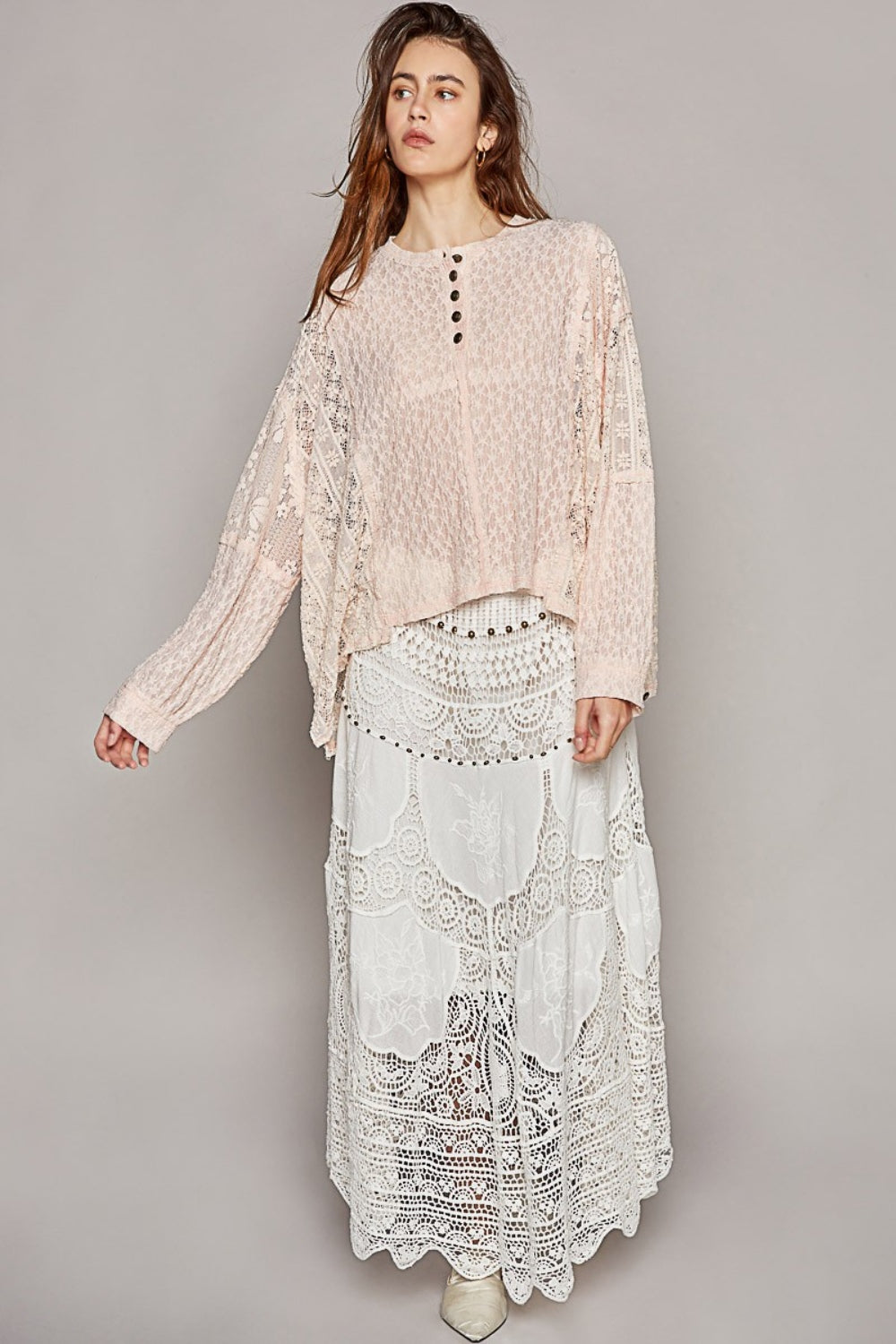 A person with long hair wearing the POL Round Neck Long Sleeve Raw Edge Lace Top and a matching white lace skirt poses against a plain background.