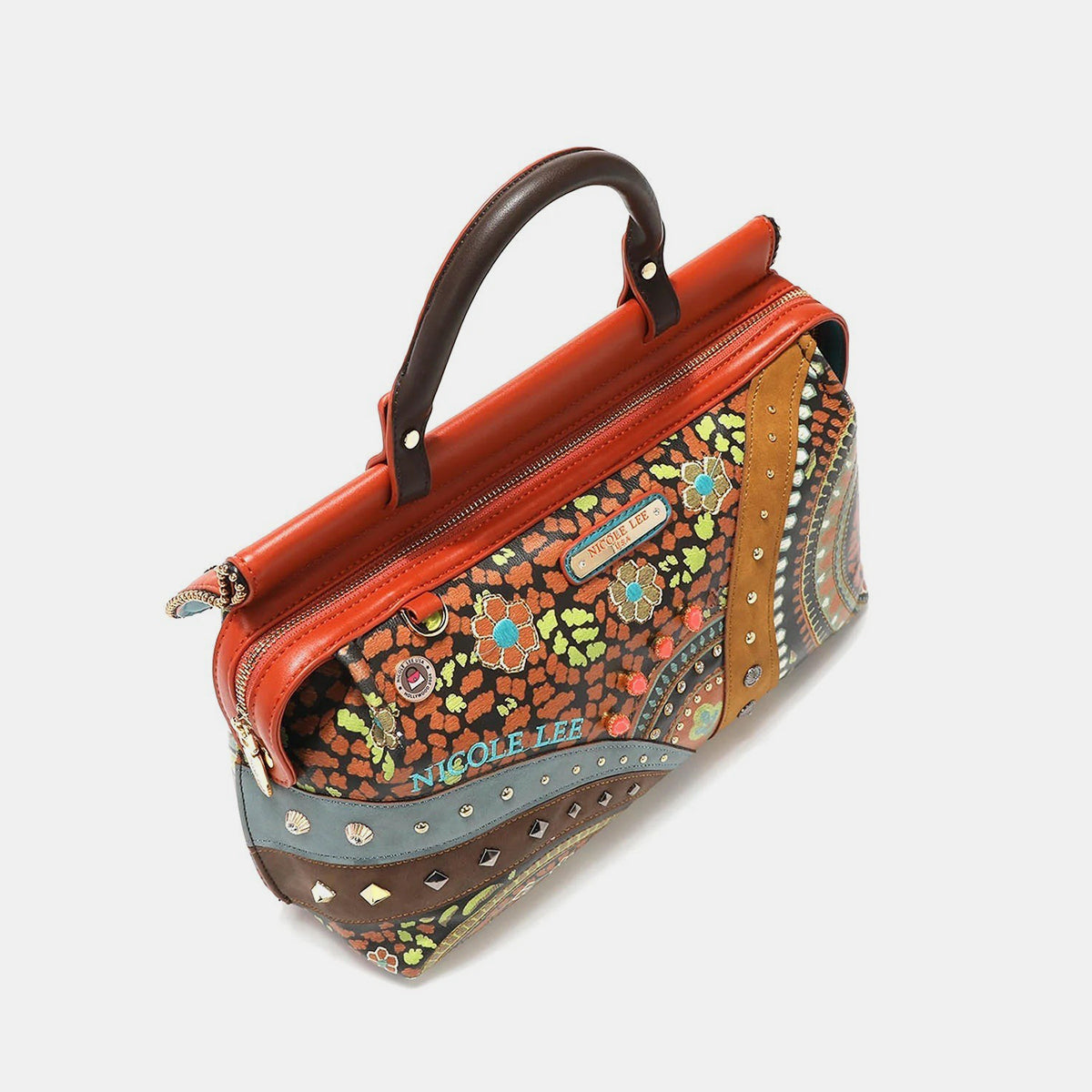 Nicole Lee USA's Front Stitch Detail Inlaid Stud Handbag is a lively vegan leather piece featuring brown handles, a blend of floral and geometric patterns, inlaid studs, and an ornamental charm.