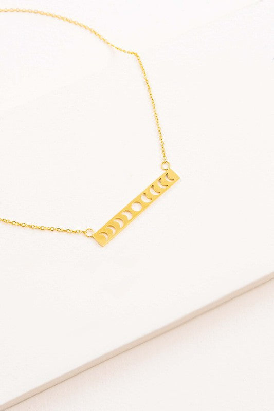 Lunar Phase Bar Necklace with an 18K gold over stainless steel bar pendant on a white background.