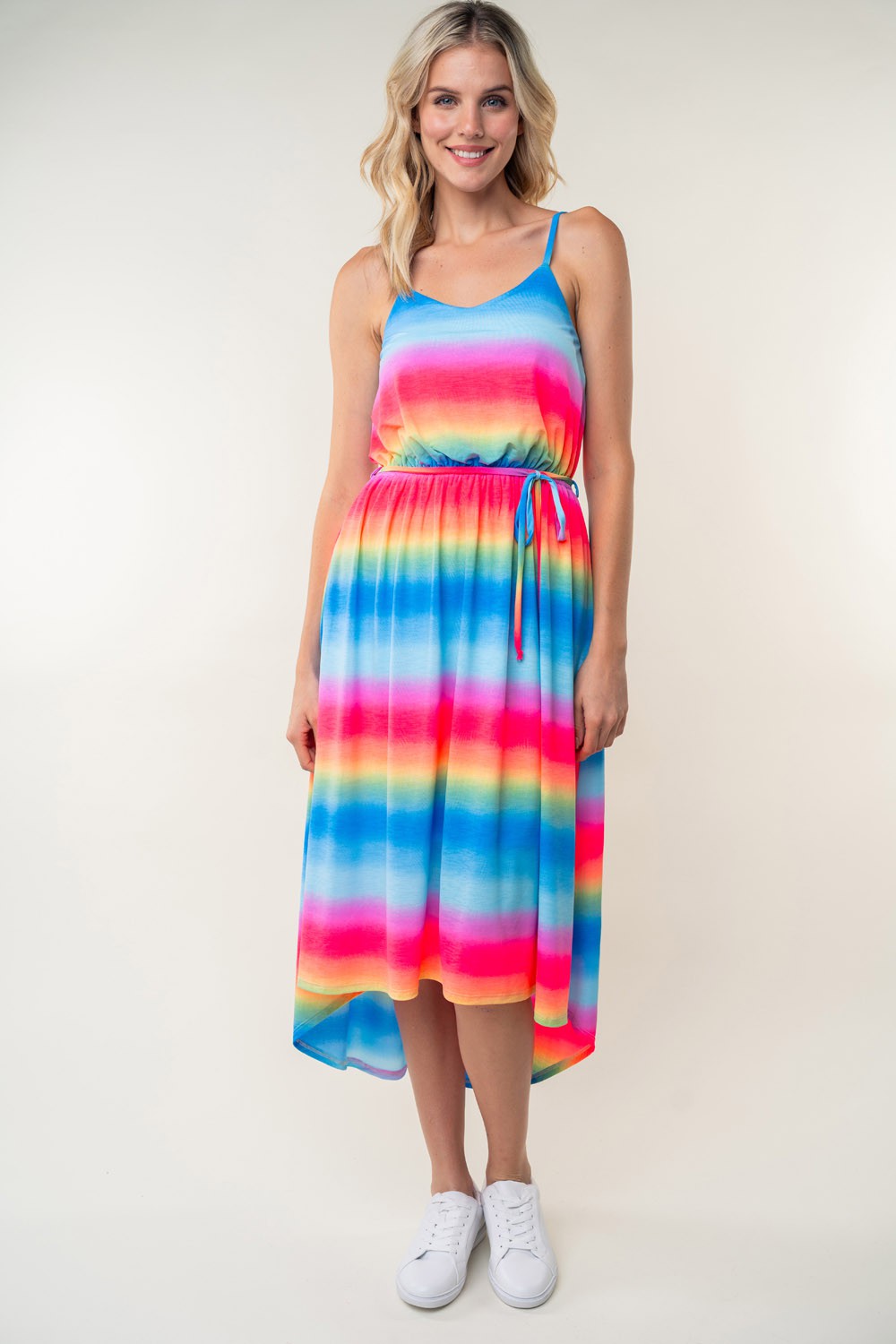 A person in a White Birch Full Size Ombre Striped Midi Cami Dress paired with white sneakers stands against a plain background.