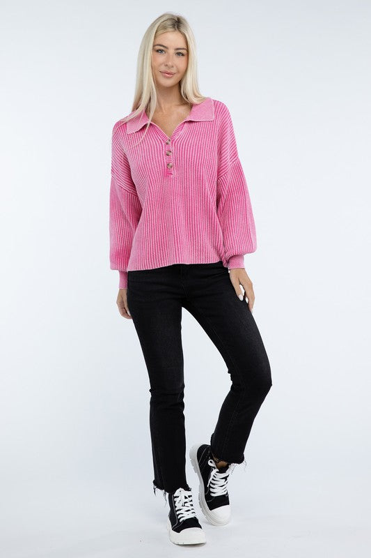 A woman with long blonde hair is wearing the Washed Collared Henley Sweater in pink and black pants, smiling at the camera.