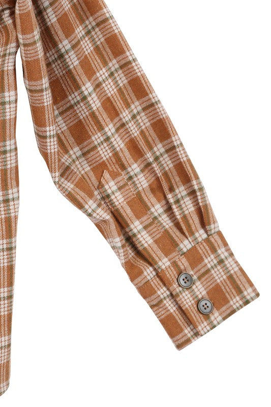 Wearing an Autumn beige plaid shirt, a person with long hair complements their look with hoop earrings, showcasing the season's warm hues. This long-sleeved shirt rests gracefully against a beige backdrop and is ideal for machine wash cold care.