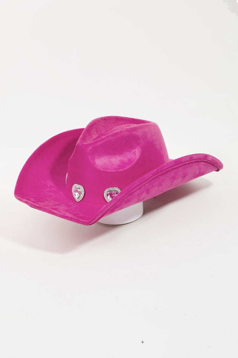 The Fame Rhinestone Pave Heart Cowboy Hat, a vibrant pink accessory made from durable polyester alloy, features three decorative silver embellishments on the front. It is showcased against a plain white background and includes an adjustable string to ensure a perfect fit for any head size.