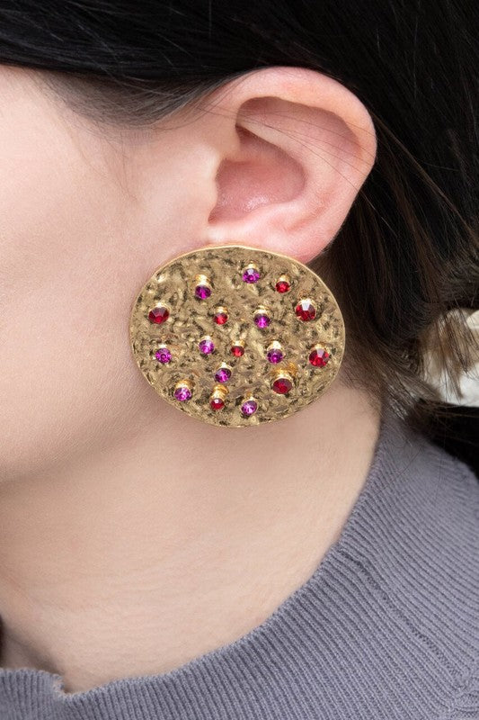 Wishing Well Plate Earrings with blue gemstone embellishments.