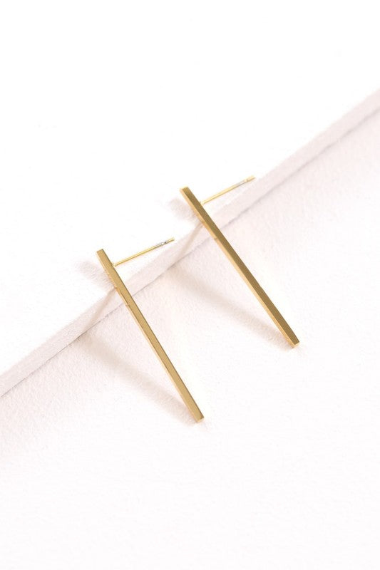 Boss Status Bar Earrings on a white textured surface.