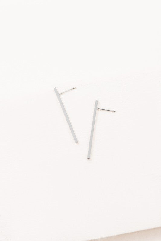 Boss Status Bar Earrings on a white textured surface.