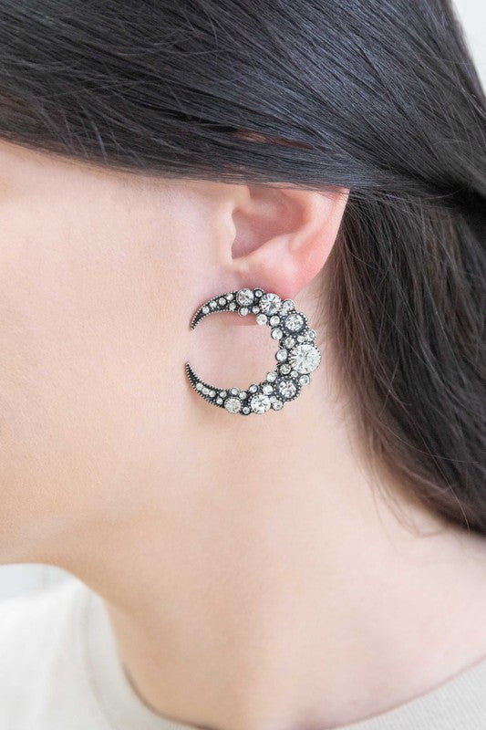 A pair of Moon Lit Night Earrings with rhinestones on a white background.