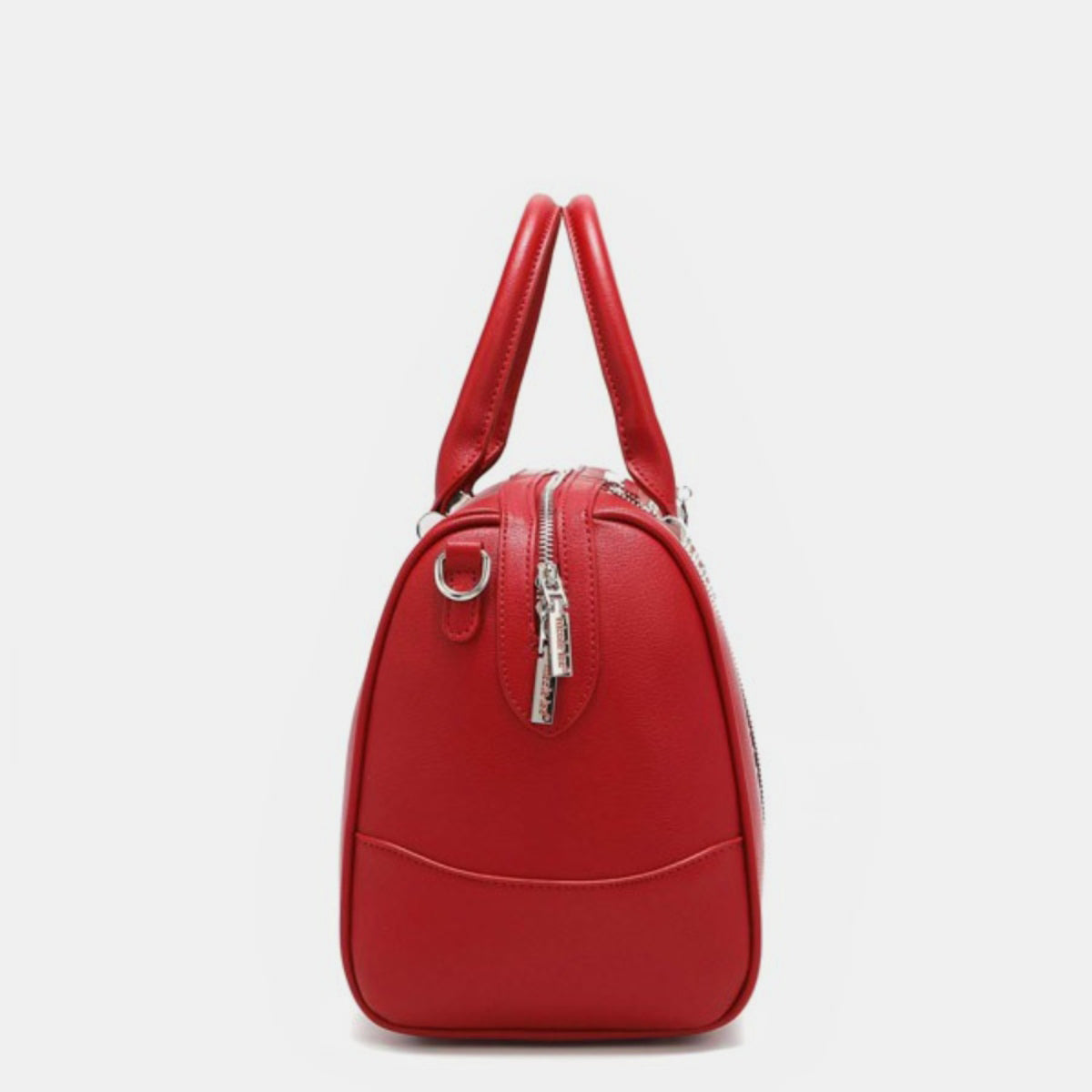 Nicole Lee USA Studded Boston Bag, crafted from luxurious vegan leather in red, showcases a design with two handles and metallic stud and ring embellishments on the front.