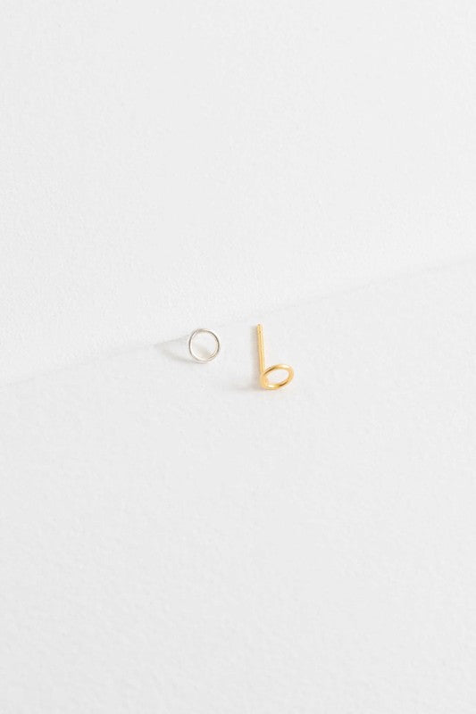 A sterling silver stud earring and a Dueling Ring Mismatched Earrings 14K, mismatched, placed side by side on a plain white background.