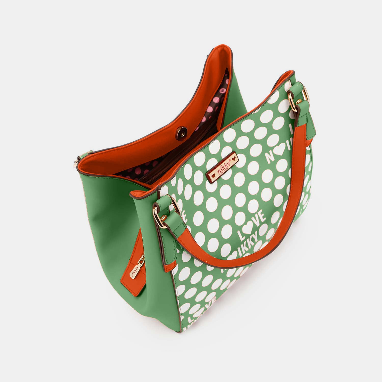 Nicole Lee USA Contrast Polka Dot Handbag made of vegan leather, featuring a green and white polka dot design, an "I LOVE NIKKY" text pattern, and a vibrant orange interior lining.