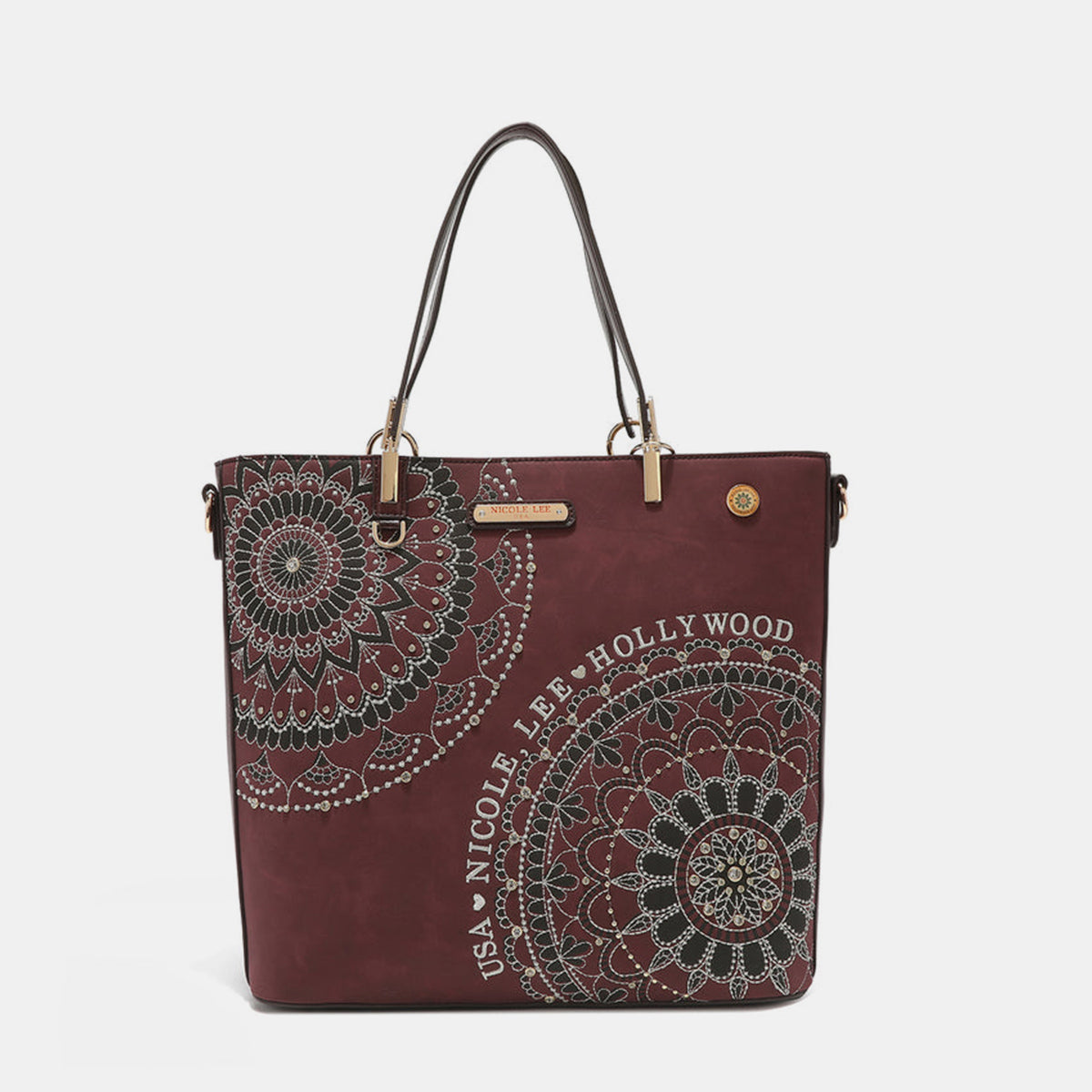 The Nicole Lee USA Metallic Stitching Embroidery Inlaid Rhinestone Tote Bag is a medium shopper in brown, crafted from vegan leather with intricate white mandala patterns and text that reads "USA Nicole Lee Hollywood." It features two shoulder straps, diamond rhinestones, and a decorative emblem on the front.