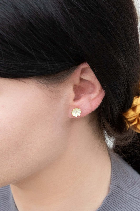 A pair of Primrose Stud Earrings on a white background.