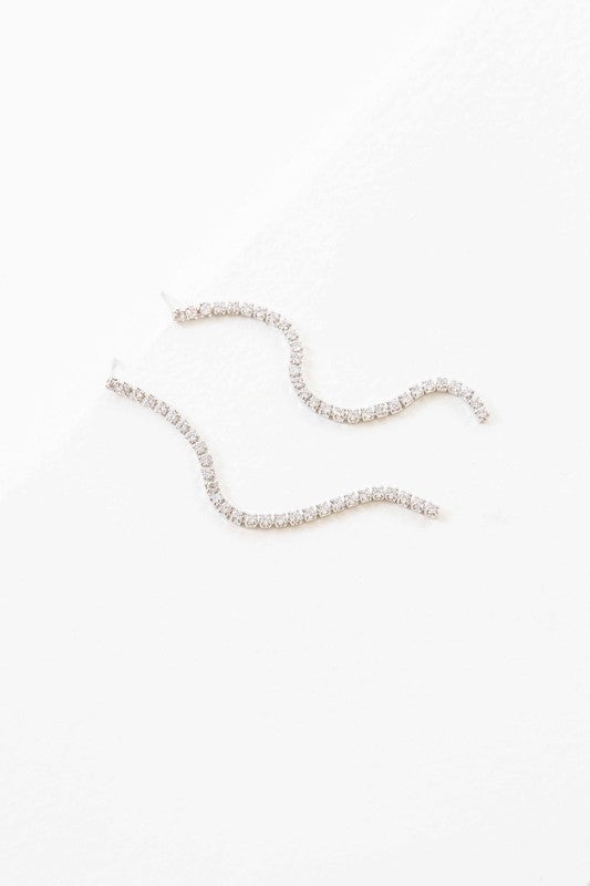 A pair of Airs and Graces sterling silver dangle earrings on a white background.