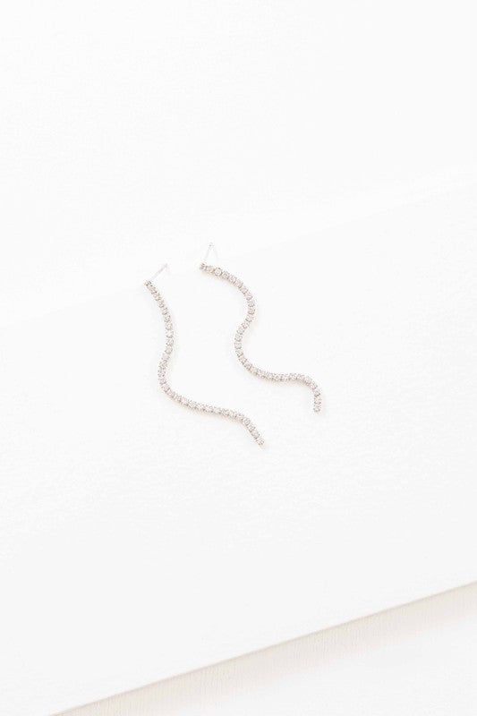 A pair of Airs and Graces sterling silver dangle earrings on a white background.