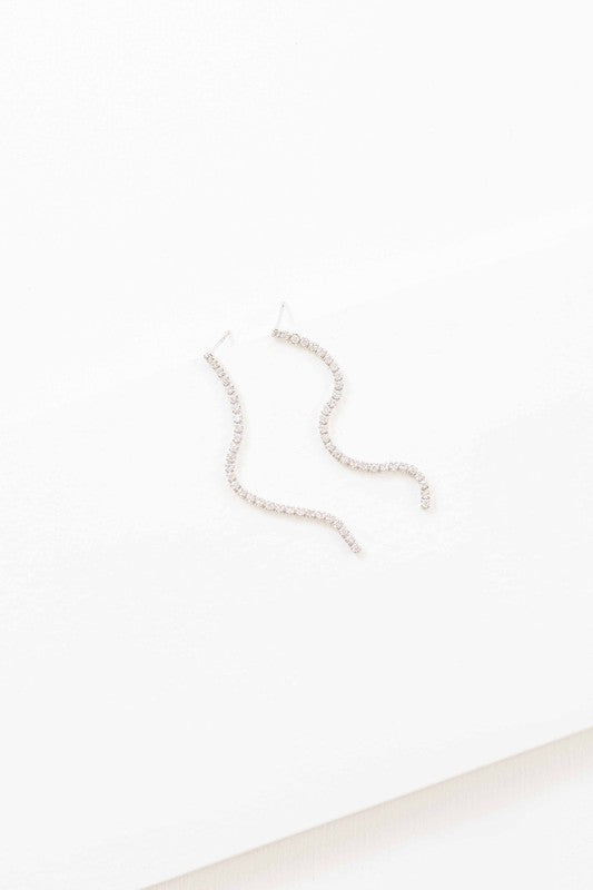 A pair of Airs and Graces sterling silver dangle earrings on a white background.