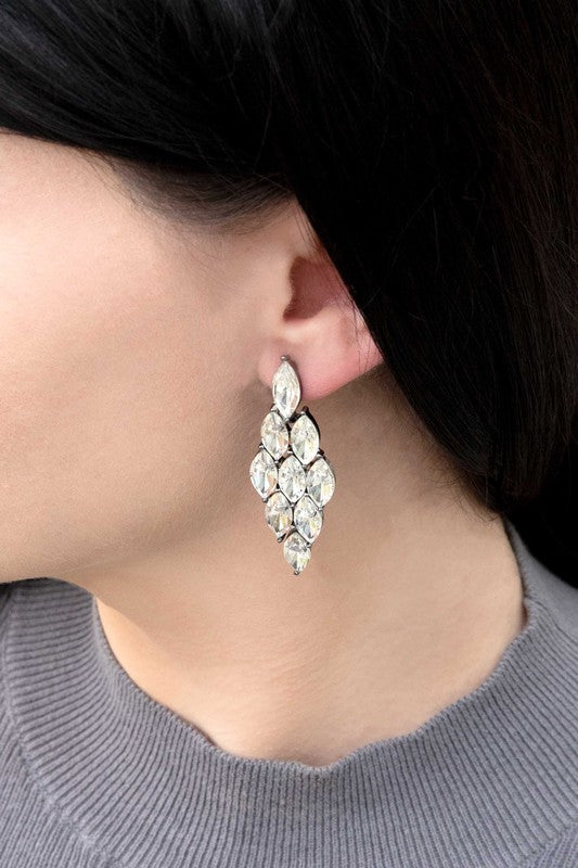 A pair of Clarity Cascade Earrings on a pale background.