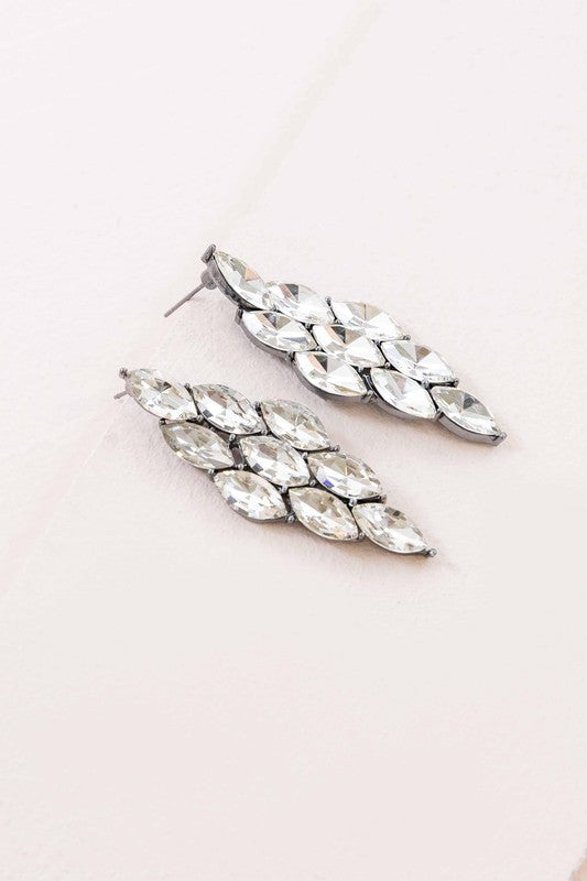 A pair of Clarity Cascade Earrings on a pale background.