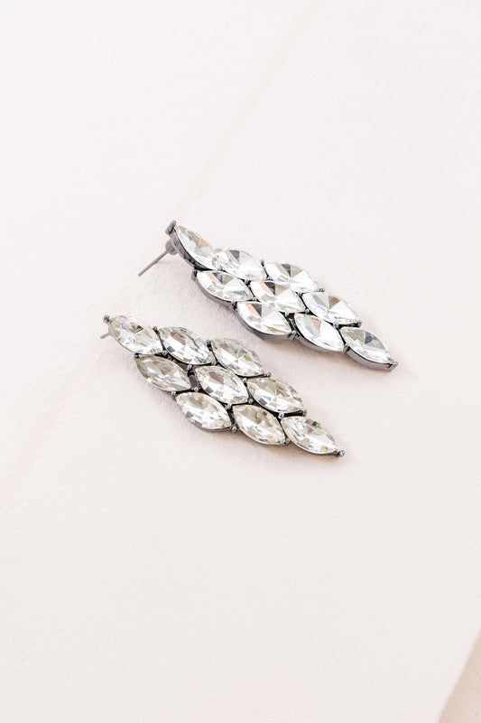 A pair of Clarity Cascade Earrings on a pale background.