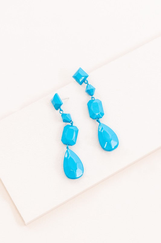 A pair of Azora Tide Drop Earrings displayed on a white background.