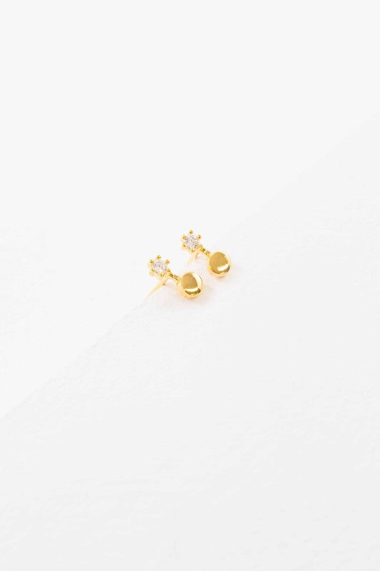 Tiny Duo Dot earrings with a gemstone accent on a white background, crafted in 14K gold over sterling silver.