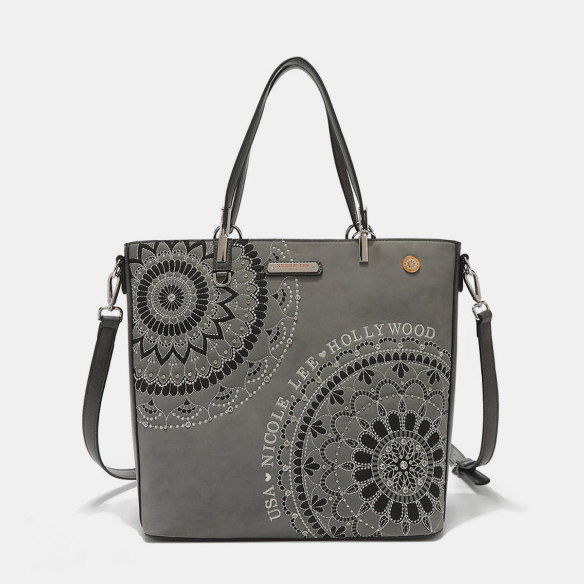 The Nicole Lee USA Metallic Stitching Embroidery Inlaid Rhinestone Tote Bag is a medium shopper in brown, crafted from vegan leather with intricate white mandala patterns and text that reads "USA Nicole Lee Hollywood." It features two shoulder straps, diamond rhinestones, and a decorative emblem on the front.