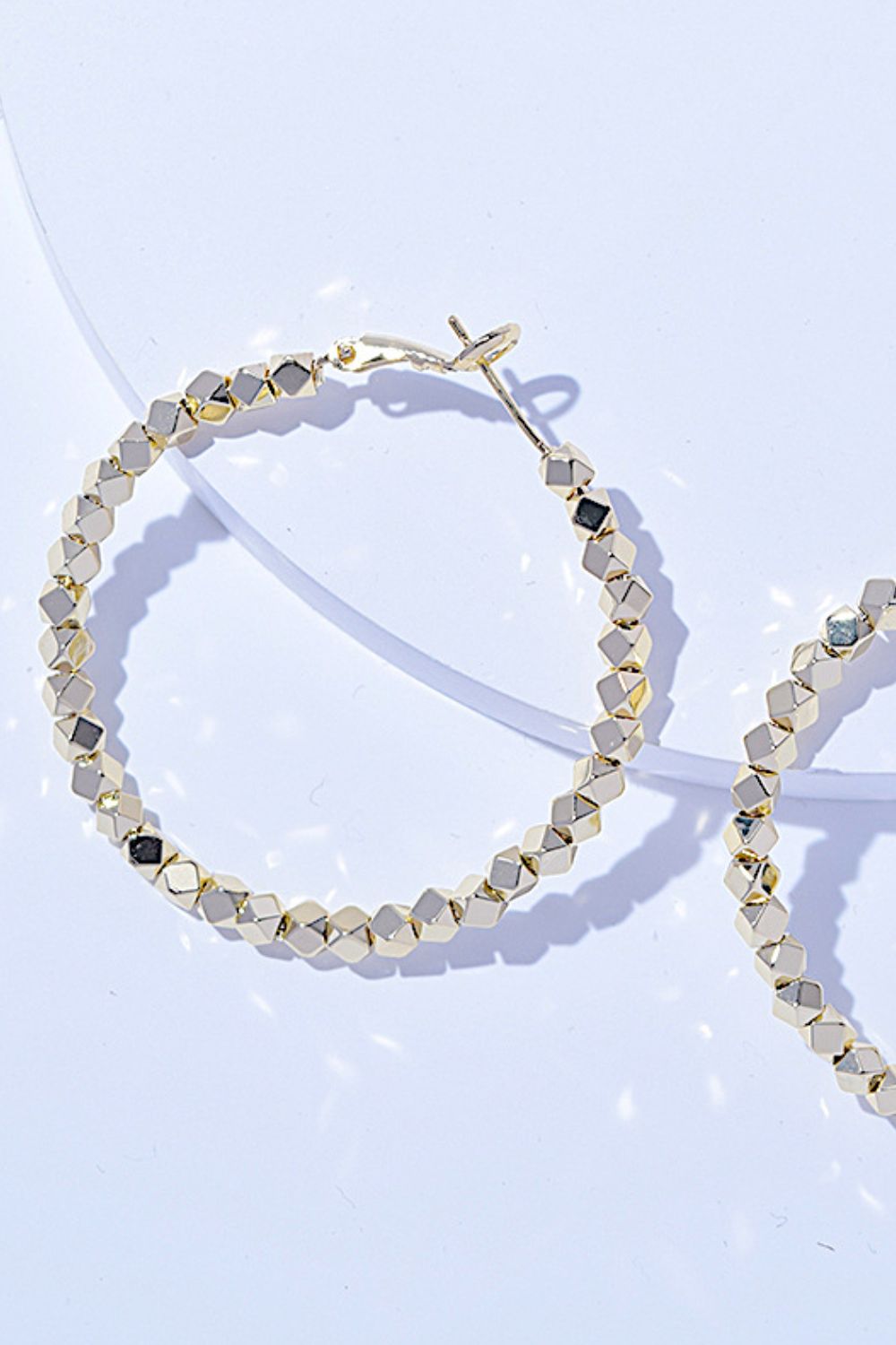 A pair of Alloy Hoop Earrings with a beaded design, displayed on a white background.