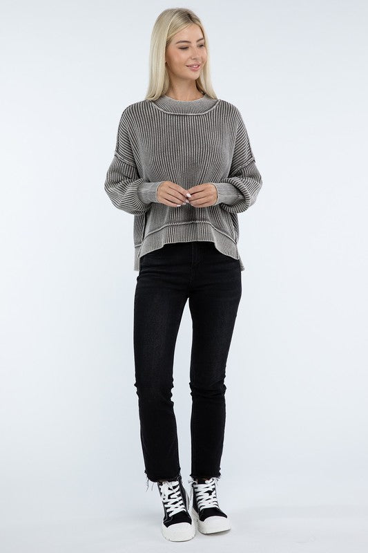 Person wearing a green Washed Side Slit Oversized Cropped Sweater with drop shoulders and black pants, standing against a plain background.