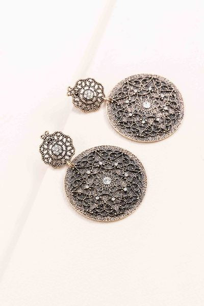 A pair of Basileia Stud Drop Earrings with rhinestone embellishments displayed on a white surface.