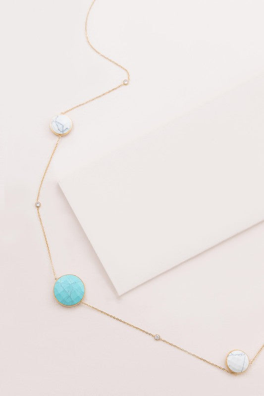 Boheme Stone Necklace with turquoise stone pendants on a white surface.