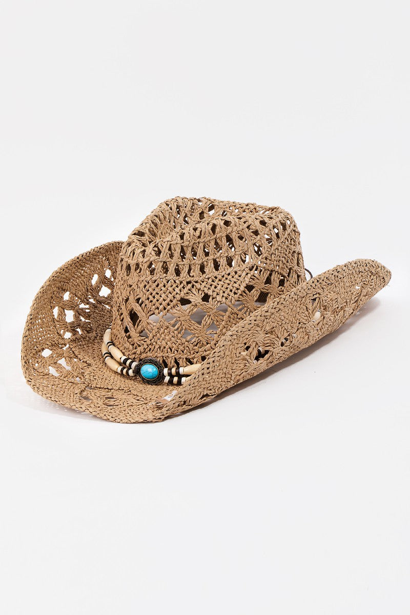 The Fame Cutout Strap Weave Straw Hat features a decorative straw strap weave, wooden beads, and a turquoise stone on the band—ideal for infusing a touch of rustic charm into your summer wardrobe or beach outings.