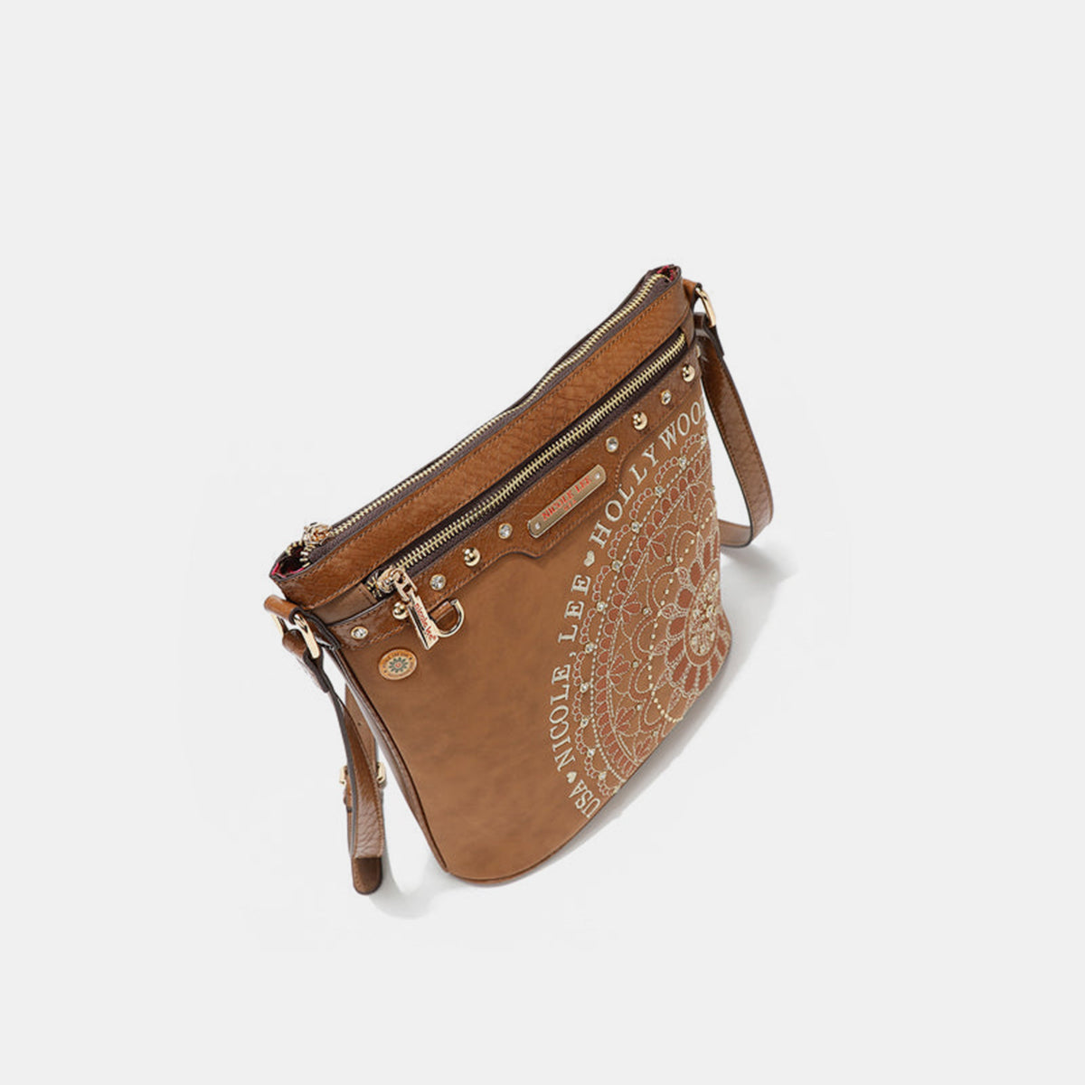 The Nicole Lee USA Metallic Stitching Embroidery Inlaid Rhinestone Crossbody Bag is a brown vegan leather accessory adorned with intricate white designs and text reading "Nicole Lee Hollywood USA" on the front. It features diamond rhinestones, multiple zippered compartments, and an adjustable strap.