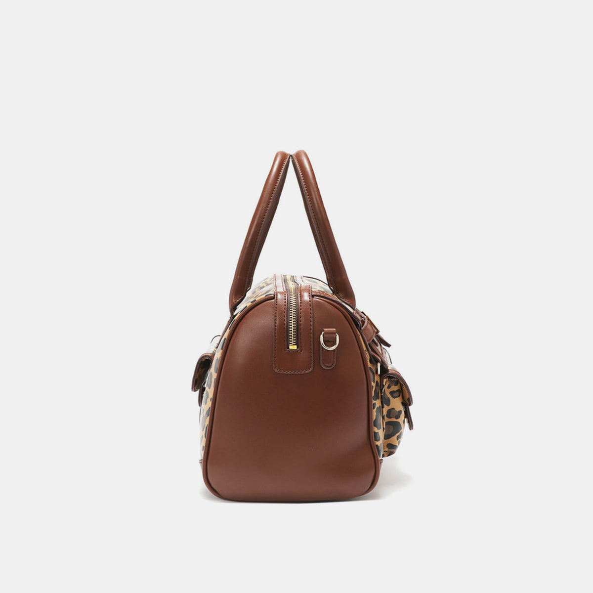 Introducing the Nicole Lee USA Leopard Boston Bag: a stylish vegan leather accessory in chic brown, boasting an eye-catching leopard print design, dual handles, multiple pockets, and adorned with a gold-tone nameplate.