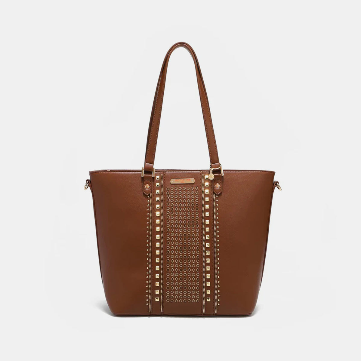 The Nicole Lee USA Studded Decor Tote Bag boasts a trendy appeal with its vegan leather material, highlighted by silver studs and dual shoulder straps, showcased against a white background.