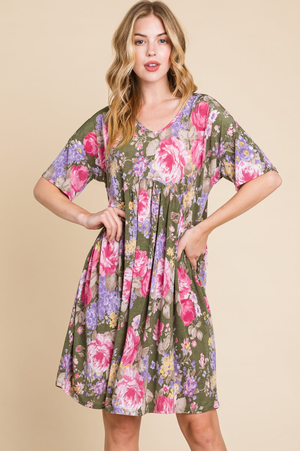 A woman in a BOMBOM Flower Print V-Neck Ruched Dress.