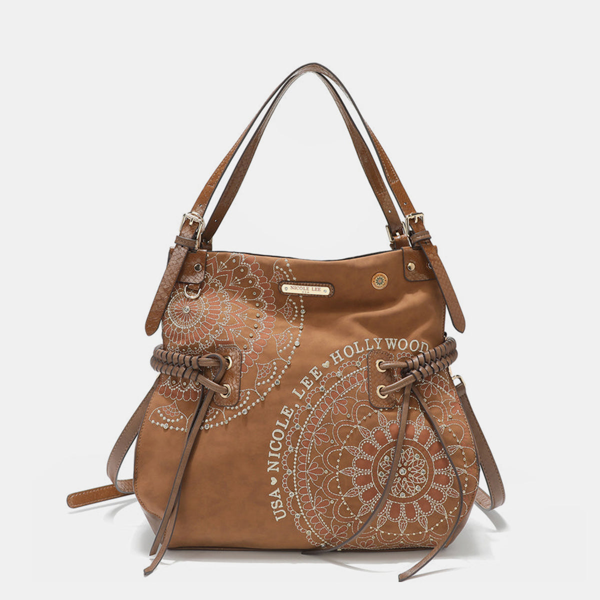 The Nicole Lee USA Side Braided Tassel Inlaid Rhinestone Embroidery Hobo Bag features intricately designed white mandala patterns on brown vegan leather, along with "Nicole Lee Hollywood USA" text. It includes top handles and decorative braided accents, as well as adjustable dual shoulder straps for added versatility.