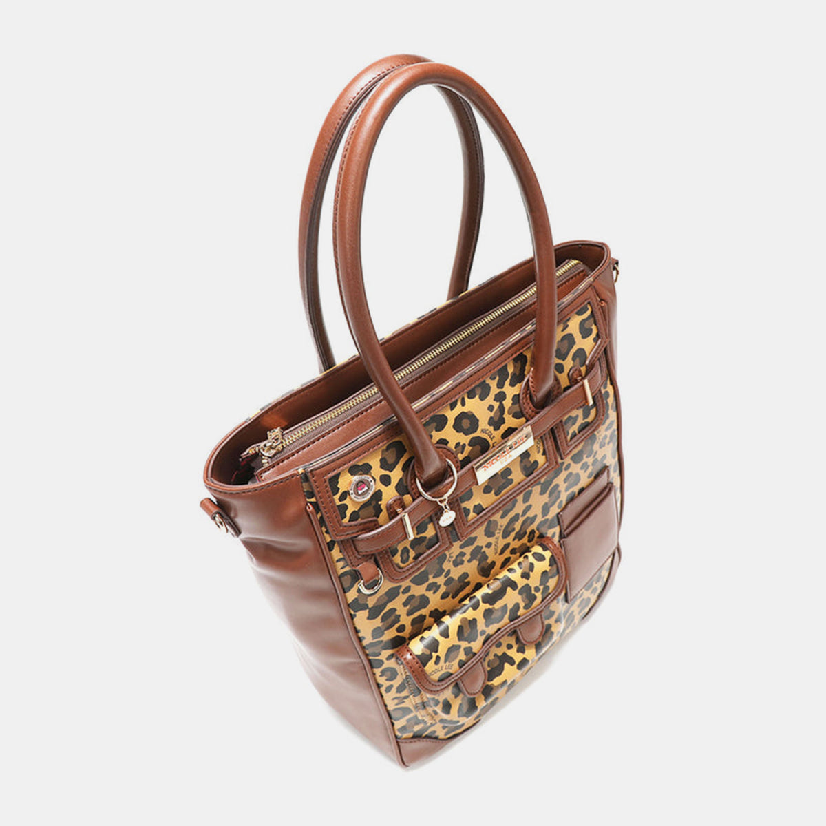 The Nicole Lee USA Leopard Large Tote Bag is a chic leopard print handbag made from vegan leather, featuring two handles, multiple pockets, a buckle, and zipper details.