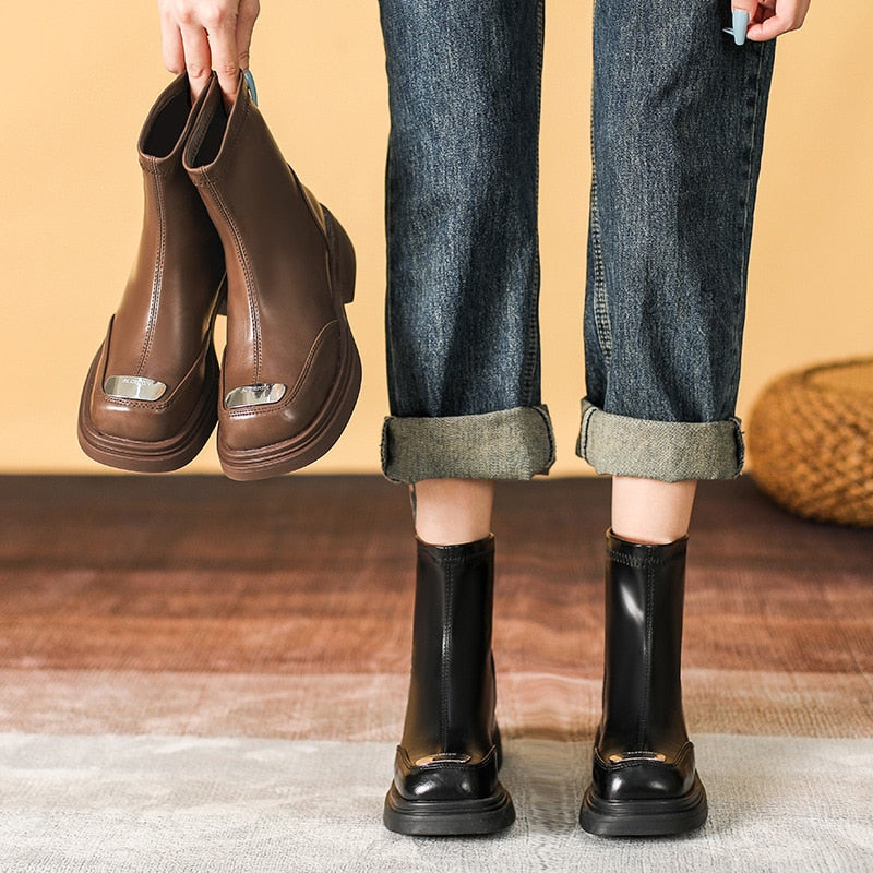 A pair of black and brown Brown Pu Leather Ankle Boots for Women Autumn Winter Short Plush with metallic accents, displayed on a woven surface.