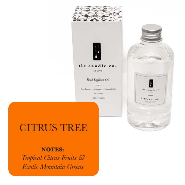 A bottle of refill oil, elegantly boxed and labeled "Refill Oil - Citrus Tree" by tlc candle co., is scented with chemical-free notes of tropical citrus fruits and exotic mountain greens.