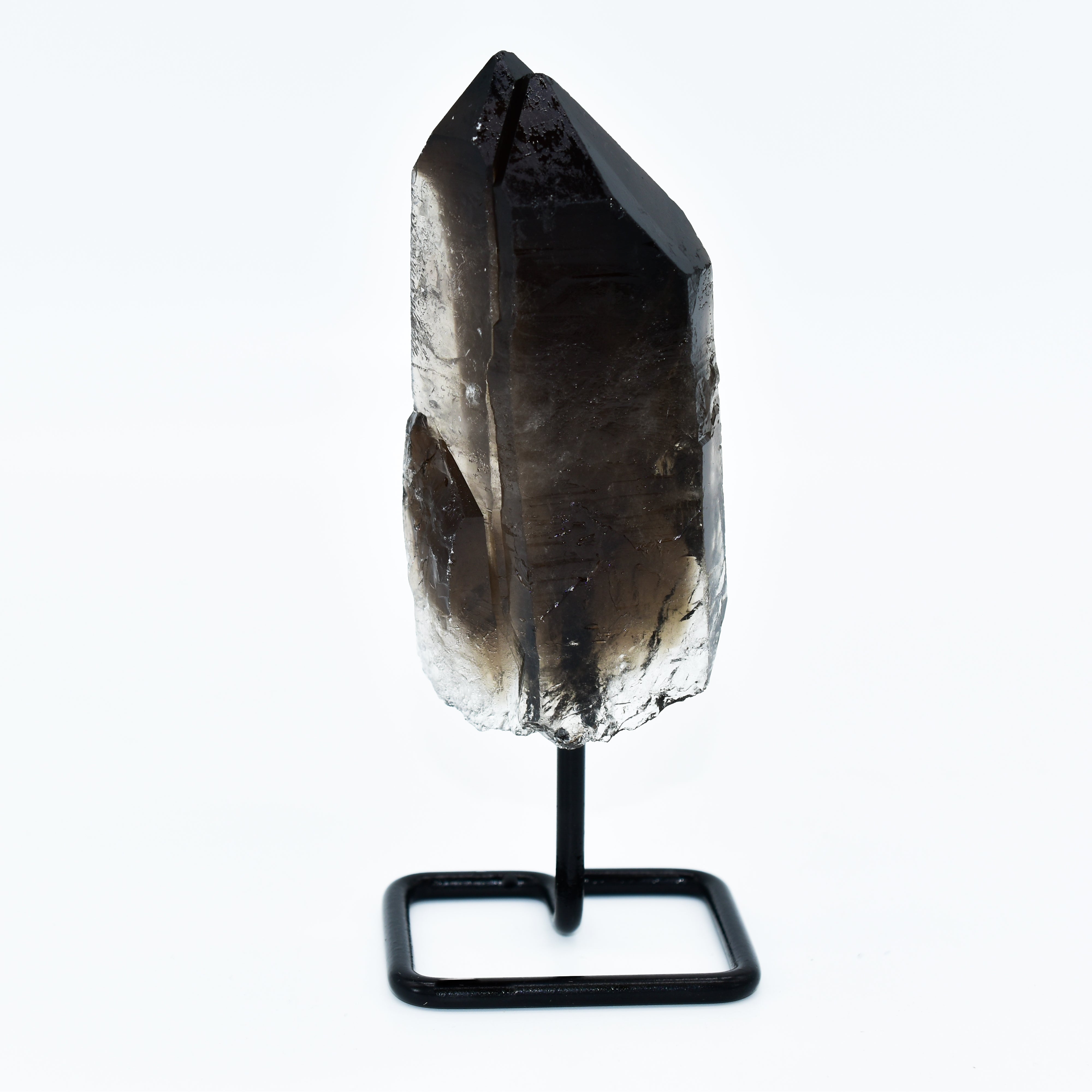 The Smokey Quartz Points on Metal Base Small Display Piece stands elegantly upright, adding a touch of sophistication to your home decor against a plain white background.