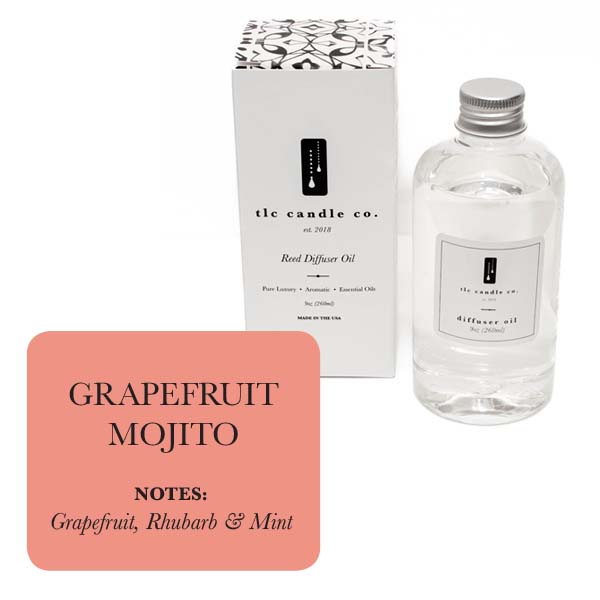 The product "Refill Oil - Grapefruit Mojito" from "tlc candle co." emits refreshing scents of zesty grapefruit, crisp rhubarb, and cool mint, and is stylishly presented alongside its chic packaging.