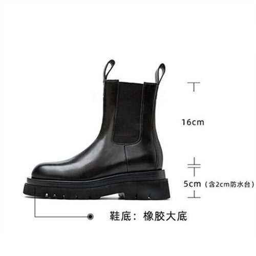 A pair of black Houzhou Woman Chelsea Boots Fashion Platform with thick soles, displayed in an open shoe box with white tissue paper.
