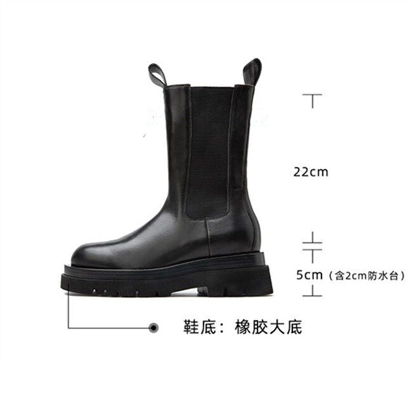 A pair of black Houzhou Woman Chelsea Boots Fashion Platform with thick soles, displayed in an open shoe box with white tissue paper.