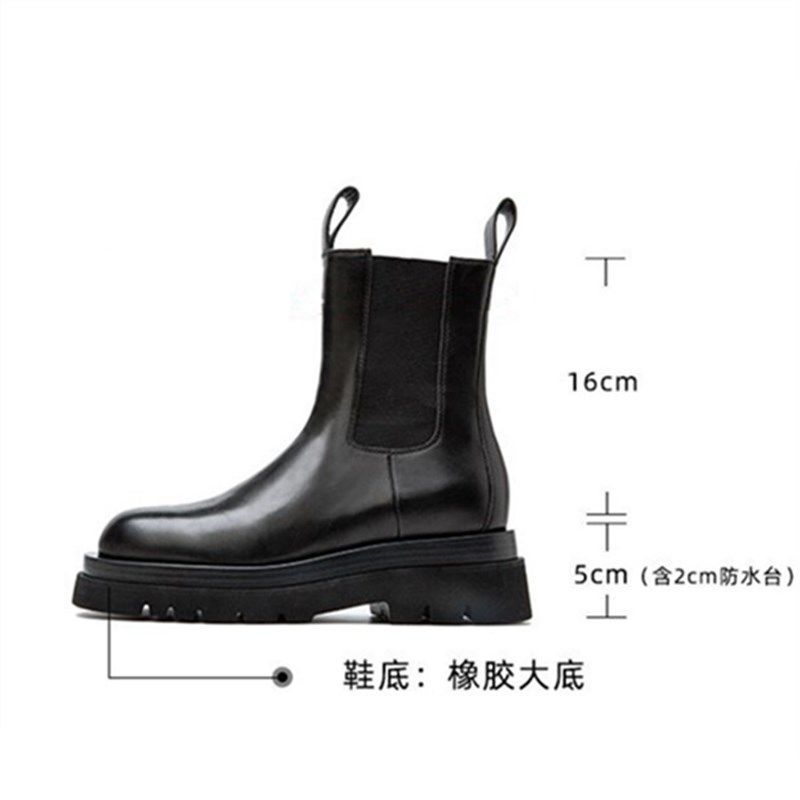 A pair of black Houzhou Woman Chelsea Boots Fashion Platform with thick soles, displayed in an open shoe box with white tissue paper.