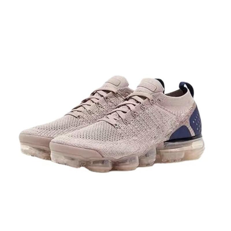 Purple sneakers women casual shoes mesh air-cushion flat on a person's feet, showcasing the sleek design and exceptional comfort from heel to toe.
