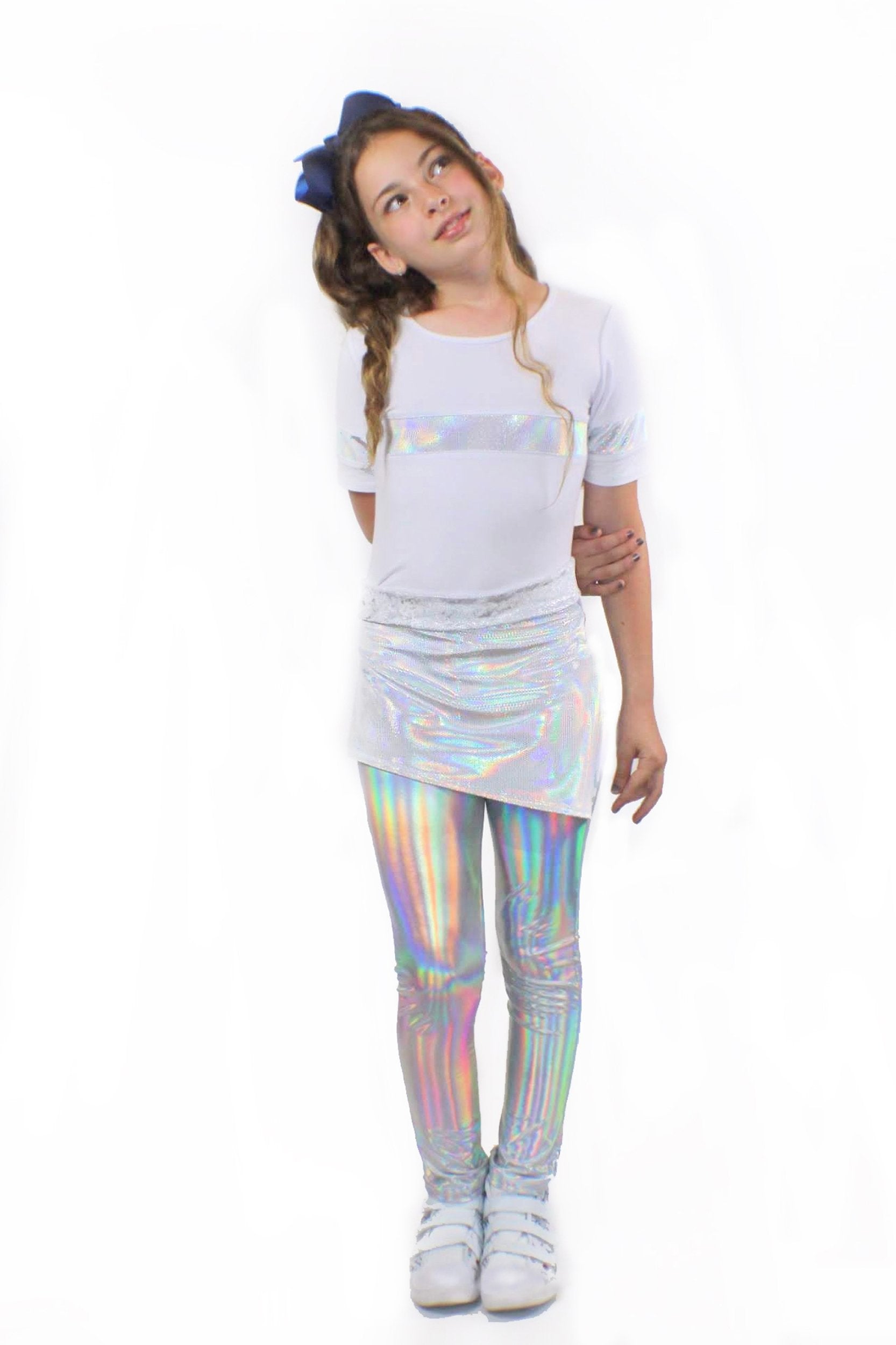 A girl wearing Mia, dizzy unicorn stretch Pants by Sky Blue Beech and a white t - shirt.