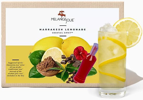 Packaging box for Mélange Jolie Marrakesh Lemonade Cocktail SipKit™ (Case of Six) next to a glass of lemonade with Marrakesh lemons slices and ice.