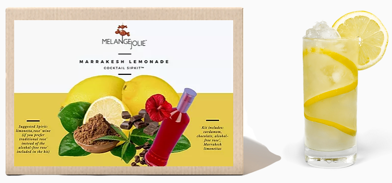 Packaging box for Mélange Jolie Marrakesh Lemonade Cocktail SipKit™ (Case of Six) next to a glass of lemonade with Marrakesh lemons slices and ice.
